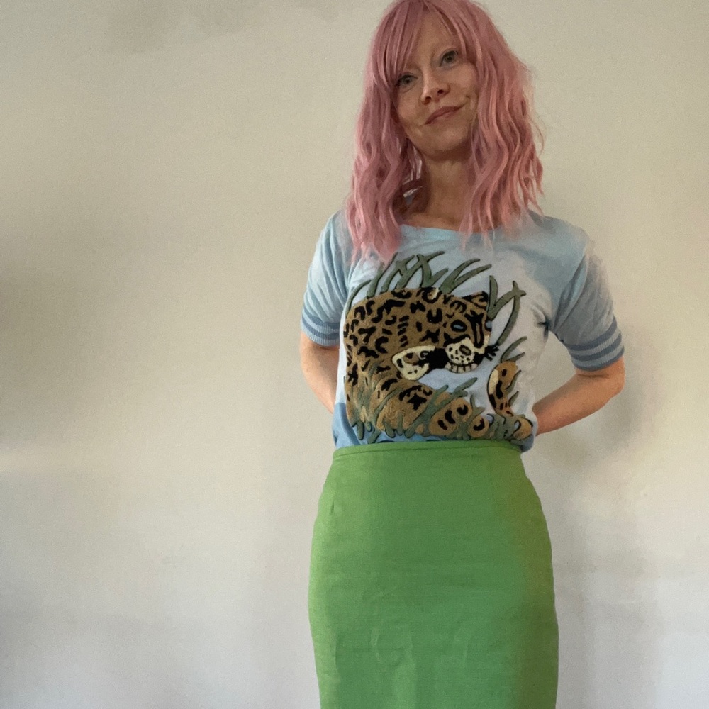Unique, vintage leopard sweater top with striped sleeve tips!